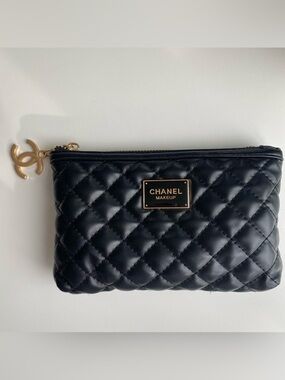 CHANEL Black Quilted Cosmetic Pouch with Gold Plaque